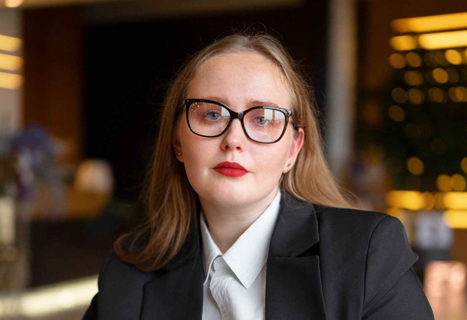 professional woman stylish suit office with tablet device